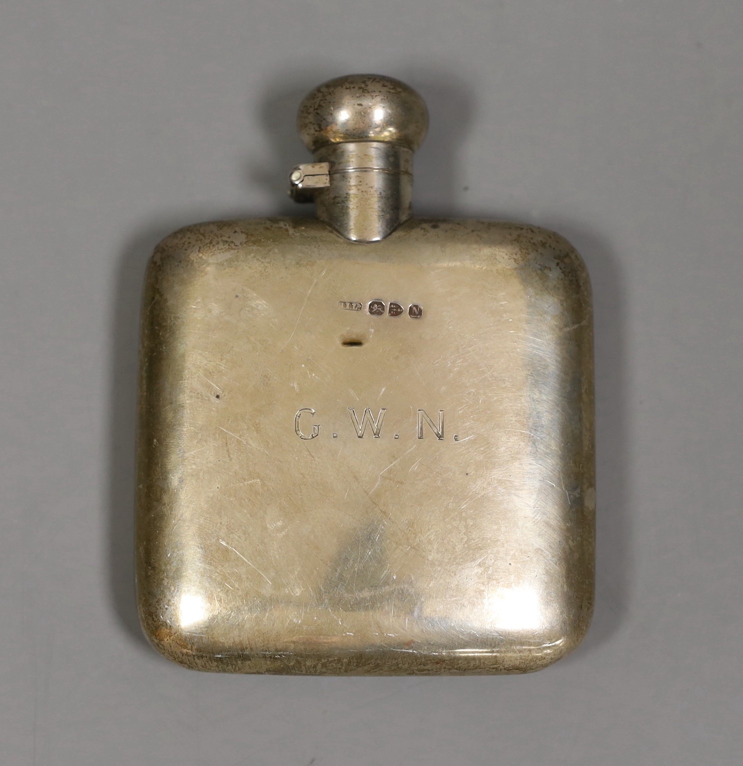 A late Victorian silver hip flask, Stokes & Ireland Ltd, Chester, 1897, 11.4cm, with engraved initials.